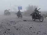 Putin’s ‘Mad Max’ infantry: Russian column travelling in stripped-back cars missing doors and windows is seen advancing through fog like scene from apocalyptic movie